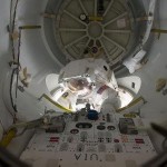Astronaut Alvin Drew gets ready for his spacewalking duties. He is partially inside and partially outside of the Quest airlock on the International Space Station.
Image Credit: NASA