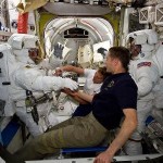 Astronauts can't just pop out the hatchway for a spacewalk, of course. There's lots of prep work to be done, including spacesuit checks. Here astronauts Clayton Anderson, left, and Rick Mastracchio check their spacesuits in preparation for a spacewalk outside the International Space Station. The room they're in is called the Quest airlock.
Image Credit: NASA
