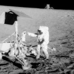 We'll close out our picture gallery by again going back in time, this time to the Apollo 12 mission. This picture is unusual because in it you can see two U.S. spacecraft on the surface of the moon as well as a moonwalker nearby for good measure. The Apollo 12 lunar module is in the background and the unmanned Surveyor III spacecraft is in the foreground. (Surveyor III had soft-landed on the moon on April 19, 1967.) The lunar module, with astronauts Charles Conrad, Jr. and Alan L. Bean aboard, landed about 600 feet from Surveyor III in the Ocean of Storms area of the moon. A television camera and several other items were taken from Surveyor III and brought back to Earth for study. In this shot, Conrad examines Surveyor's TV camera prior to detaching it. Missing out on any moonwalking was astronaut Richard F. Gordon, Jr., who remained with the command and service modules in lunar orbit.
Image Credit: NASA