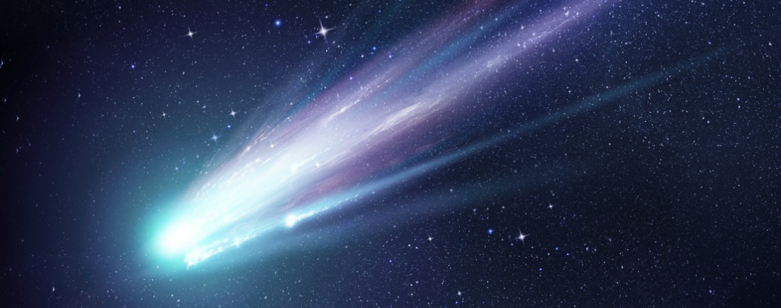 A bright comet with large dust and gas trails as the comets orbit brings it close to the Sun. Illustration.
