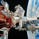 An astronaut makes adjustments to the Hubble space telescope. In the next photo, see what it's like to hover above planetary clouds.
Image Credit: World Perspectives/Getty Images