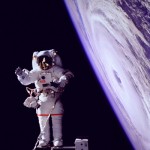Astronauts may be tethered to the Space Shuttle, attached to the Remote Manipulator Arm (as above), or equipped with free-floating maneuver packs. And sometimes they take props with them...
Image Credit: World Perspectives/Getty Images